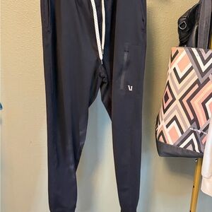 Vuori Men's Sunday Performance Jogger in black.